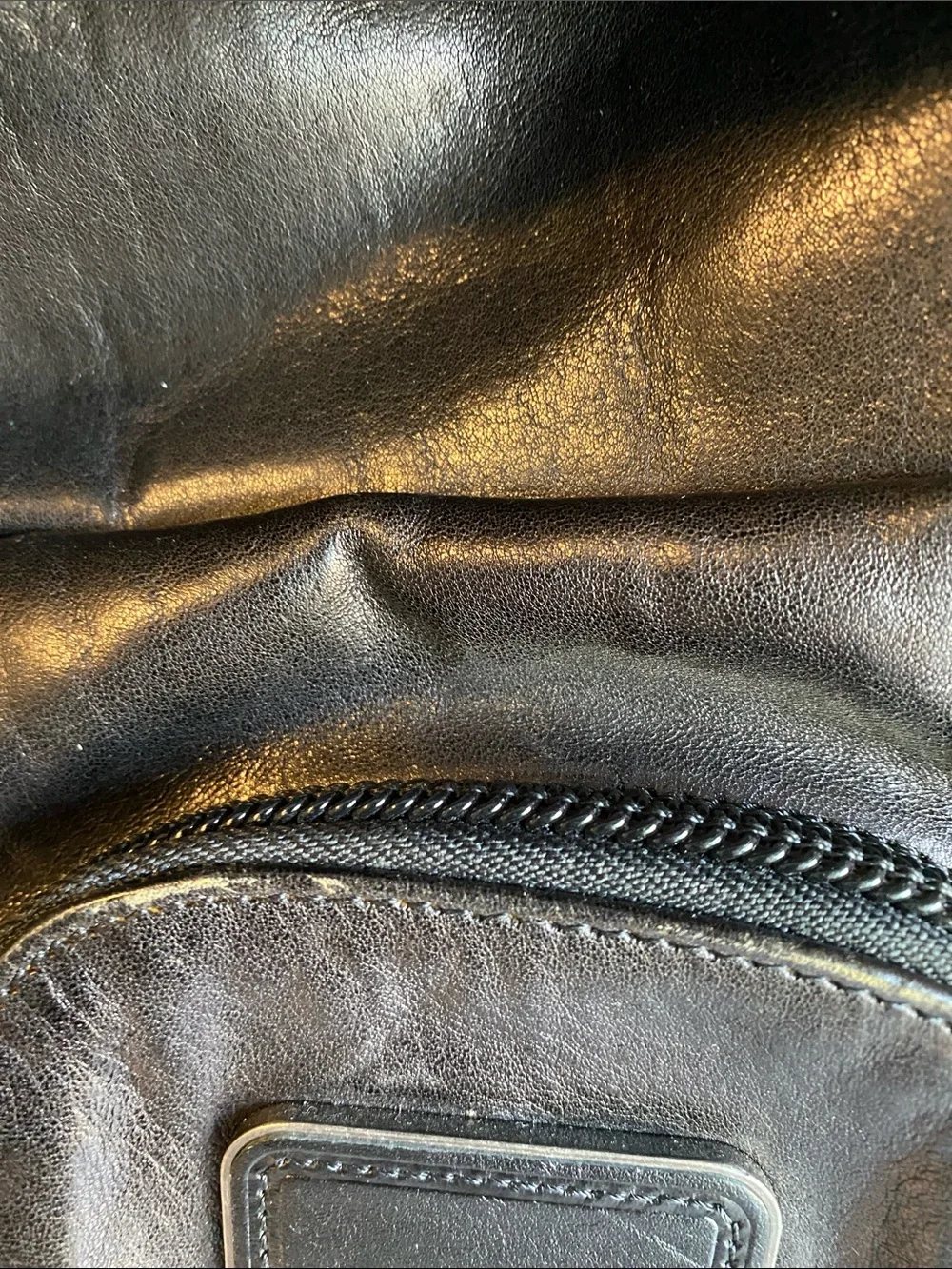 Tumi Black Leather Roll-Top Backpack with Front Pockets